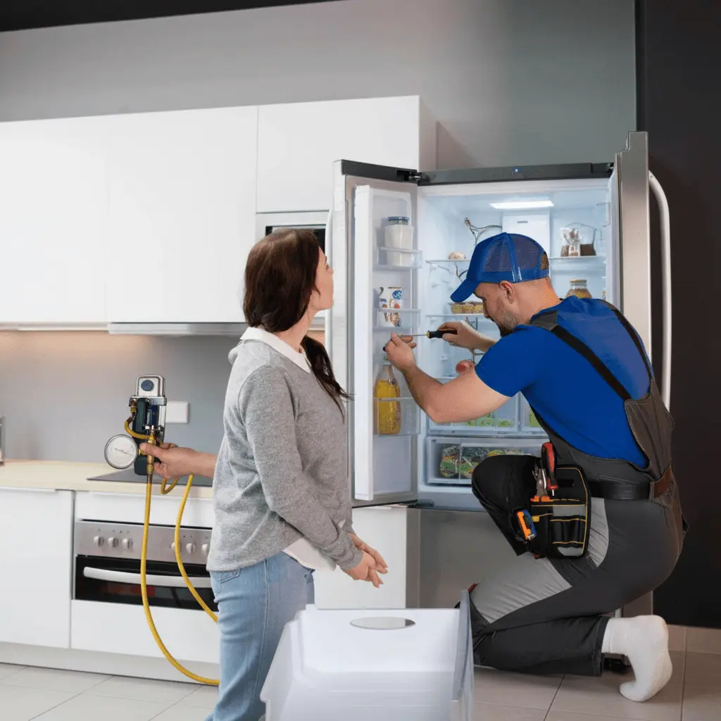 technician_repairing_refrigerator_